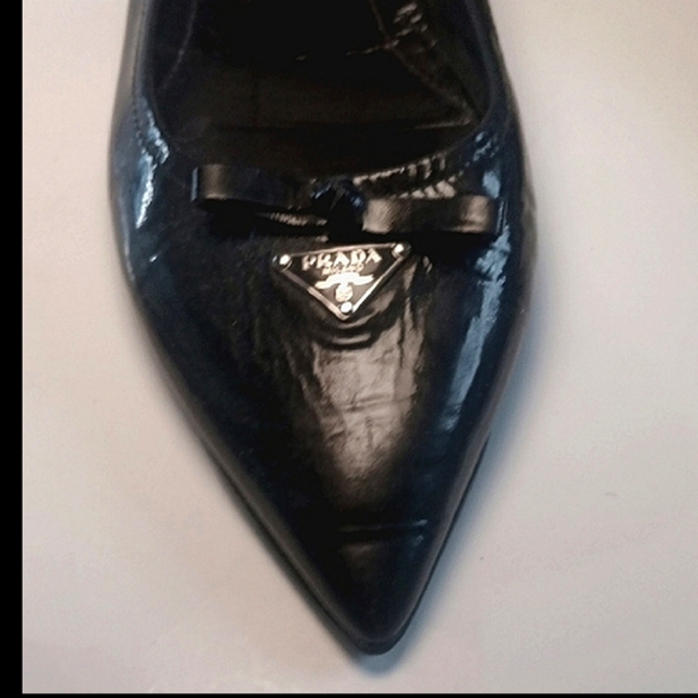 Prada Black Flats with Pointed Toe and Metal Embellishments